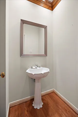 a bathroom with a sink a mirror and toilet