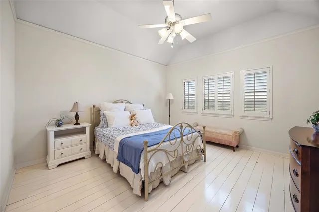 a bed room with a bed and a tv