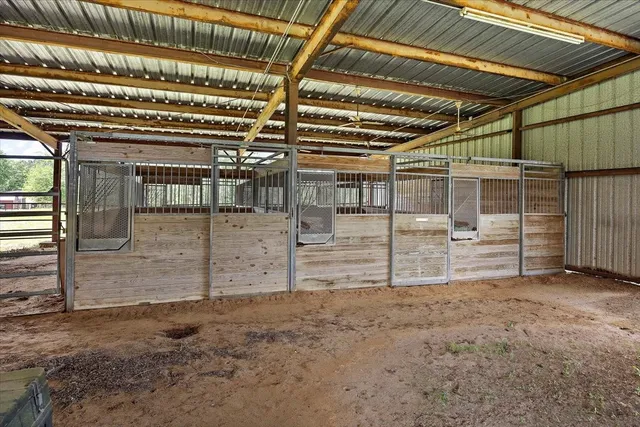 a view of empty room with wooden ceiling