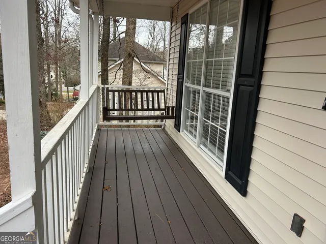 an empty room with wooden floor
