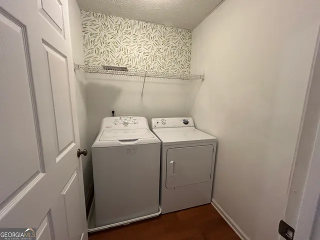 a view of staircase with rug