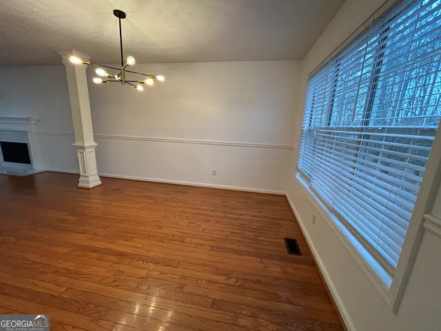 a kitchen with granite countertop a refrigerator stove top oven and sink