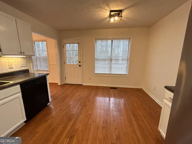 a view of entryway with wooden floor