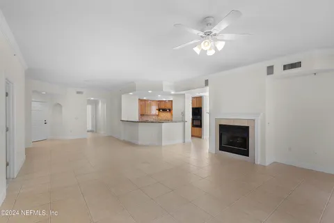 a view of an empty room with a fireplace
