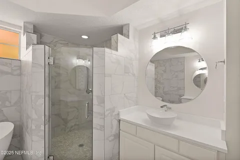 a bathroom with a sink and mirror