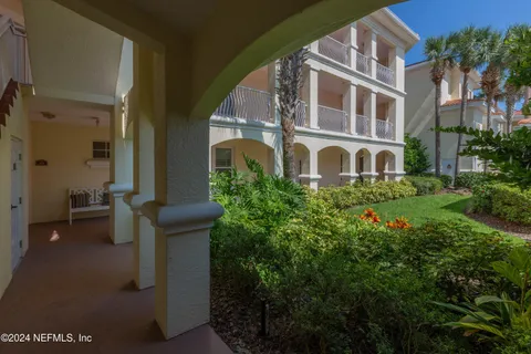 a backyard of a house with lots of green space and trees all around
