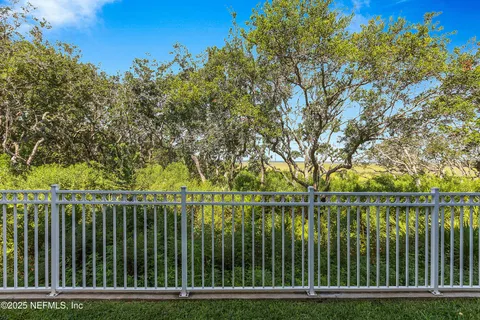 a view of a tree in a yard