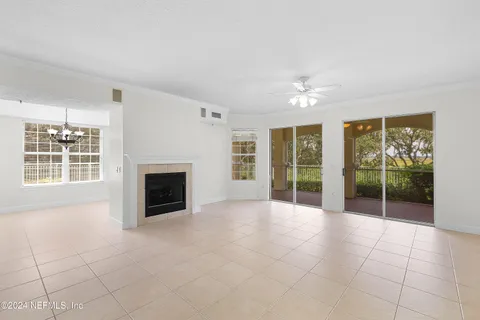 a view of an empty room with glass door and glass door