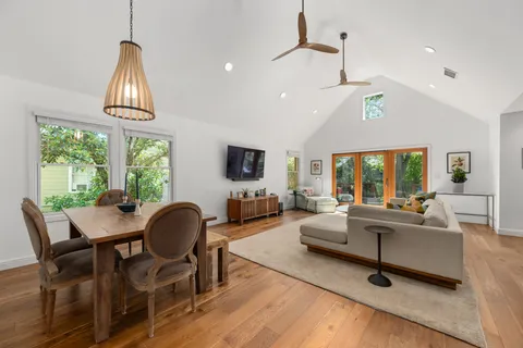 a kitchen with stainless steel appliances granite countertop a sink a stove and a refrigerator