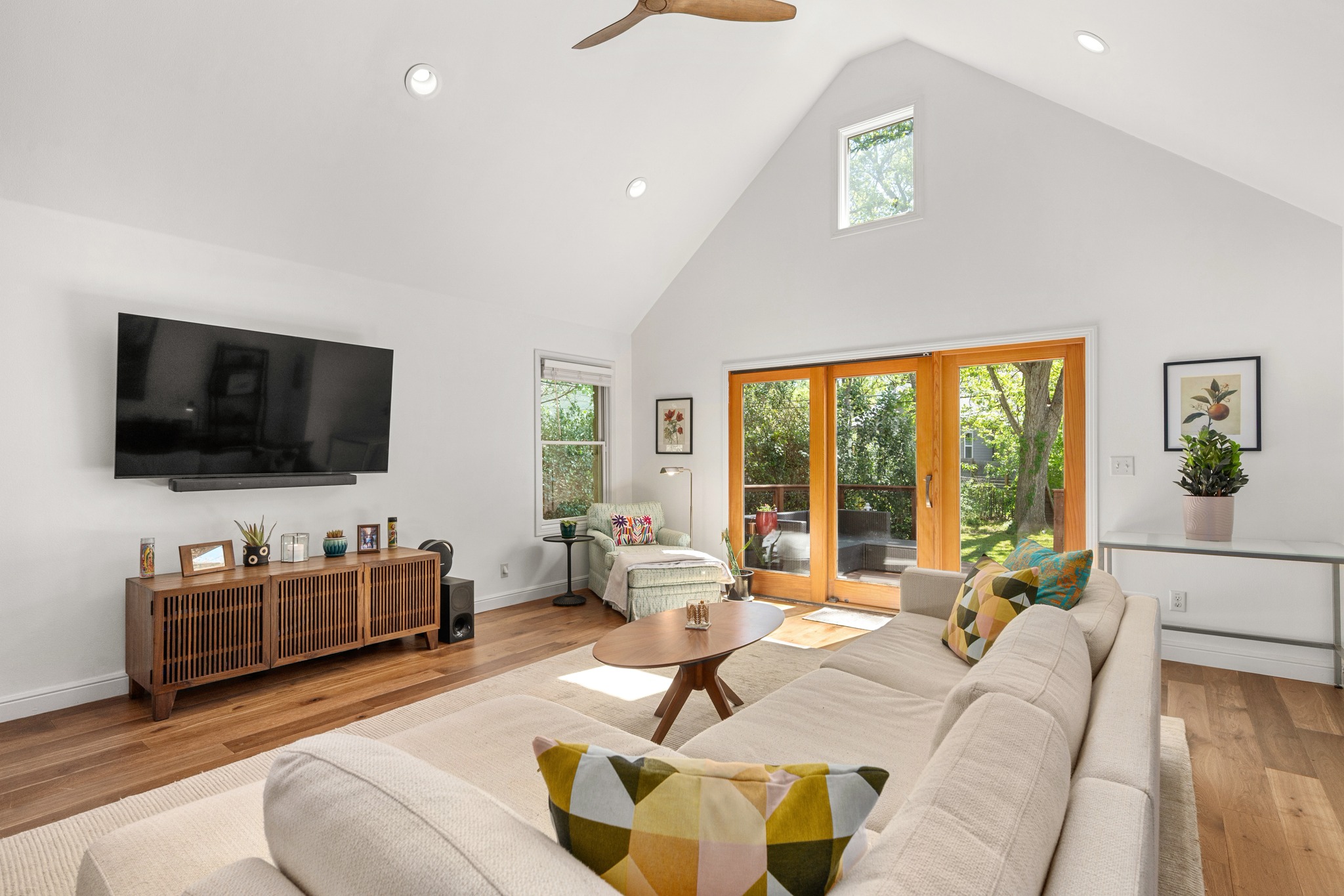 6103 Bull Creek Road Austin, TX 78757 - Photo 14 of 29 Living room featuring a high ceiling, light wood finished floors, a ceiling fan, and recessed lighting