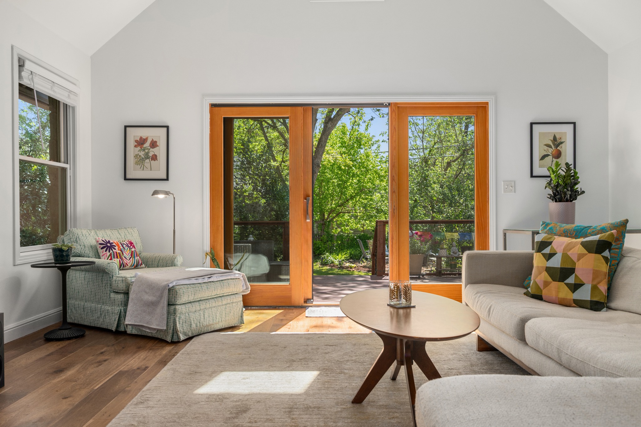 6103 Bull Creek Road Austin, TX 78757 - Photo 16 of 29 Living area with vaulted ceiling, wood finished floors, and plenty of natural light