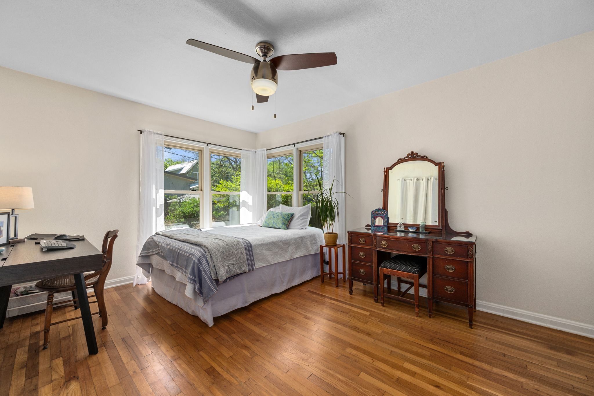 6103 Bull Creek Road Austin, TX 78757 - Photo 18 of 29 Bedroom with wood-type flooring and ceiling fan