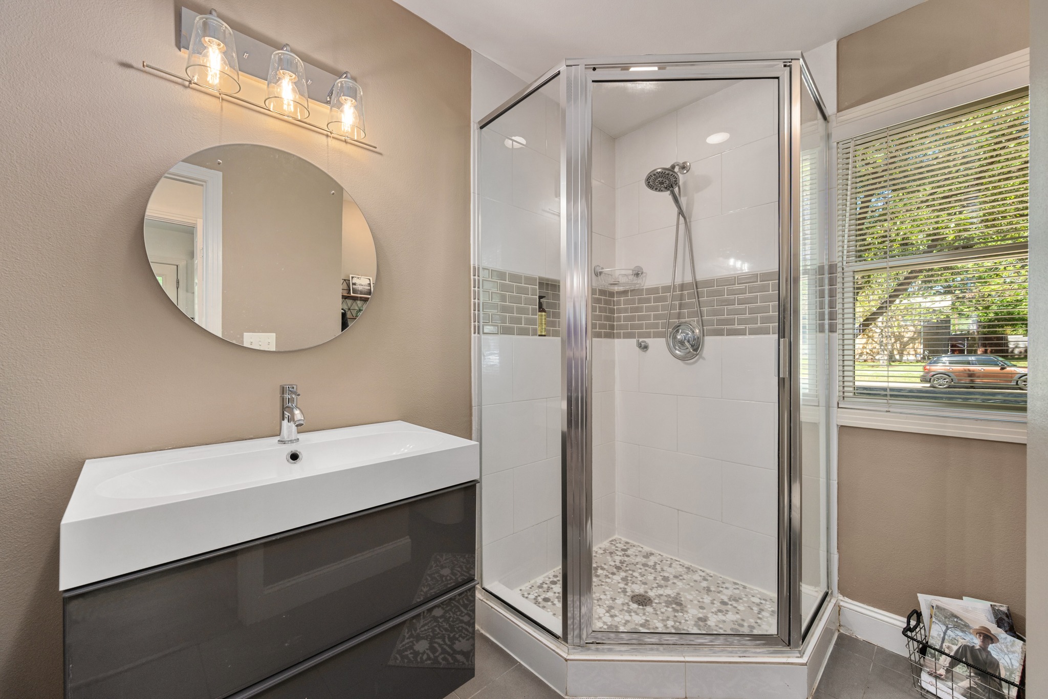 6103 Bull Creek Road Austin, TX 78757 - Photo 22 of 29 Bathroom with vanity and a stall shower