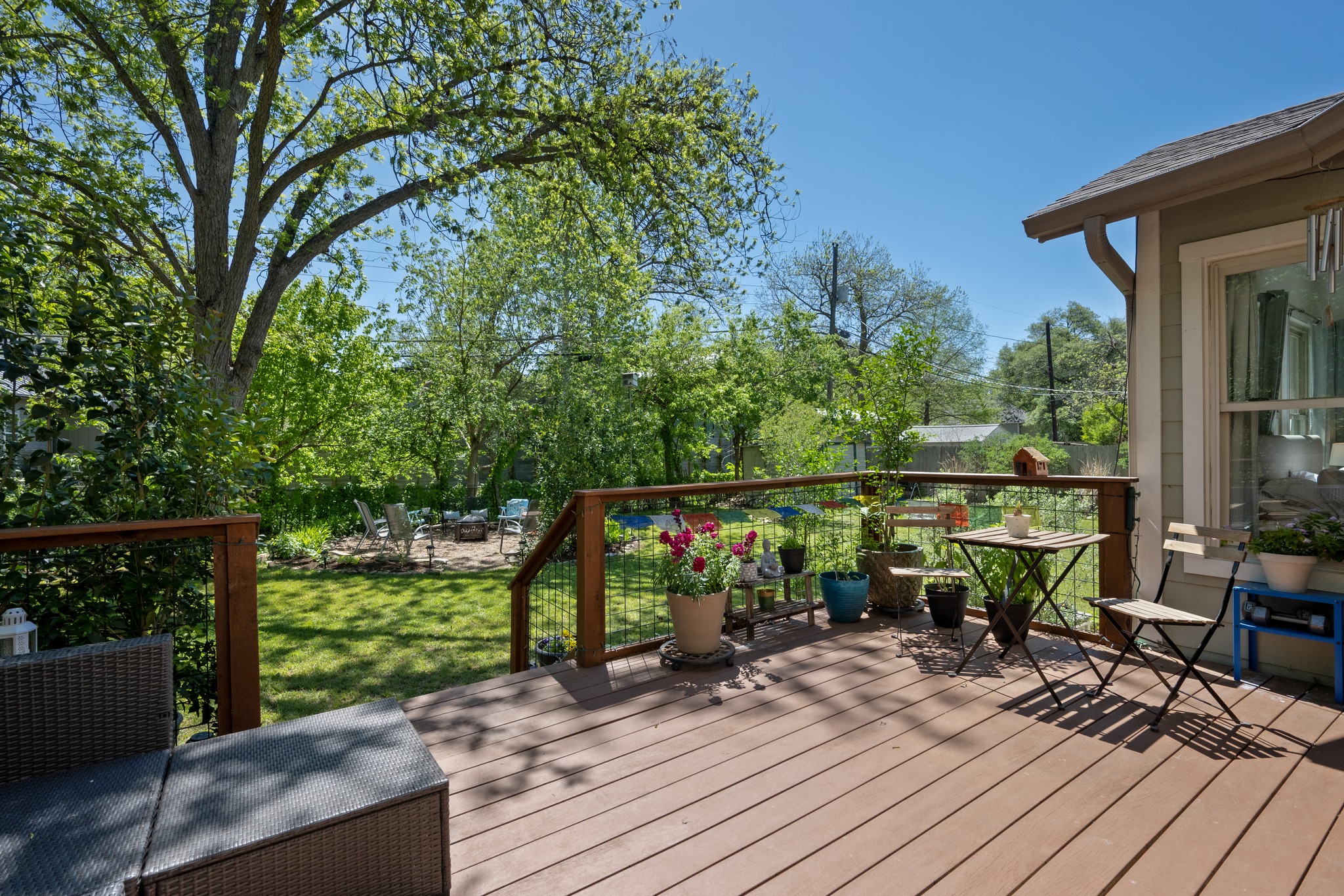 6103 Bull Creek Road Austin, TX 78757 - Photo 24 of 29 Wooden terrace with an outdoor fire pit and a yard