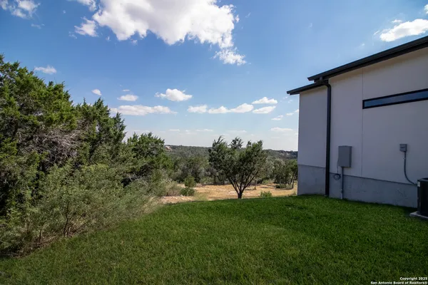 a view of house with a yard