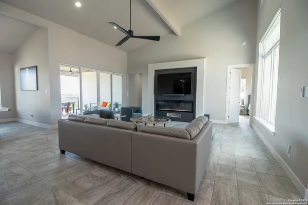 a living room with furniture and a large window