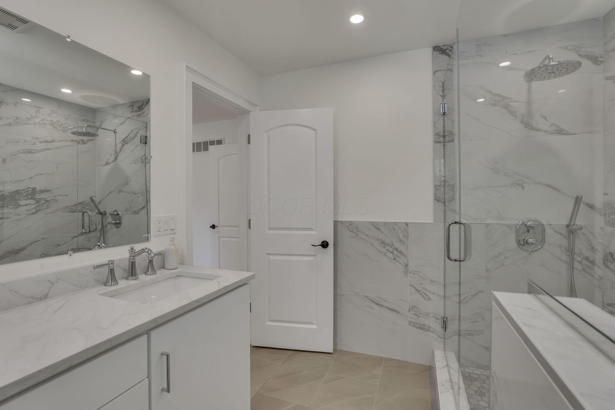 3675 Mountview Road Columbus, OH 43220 - Photo 32 of 64 Fully renovated primary bath with double vanity and large walk-in shower