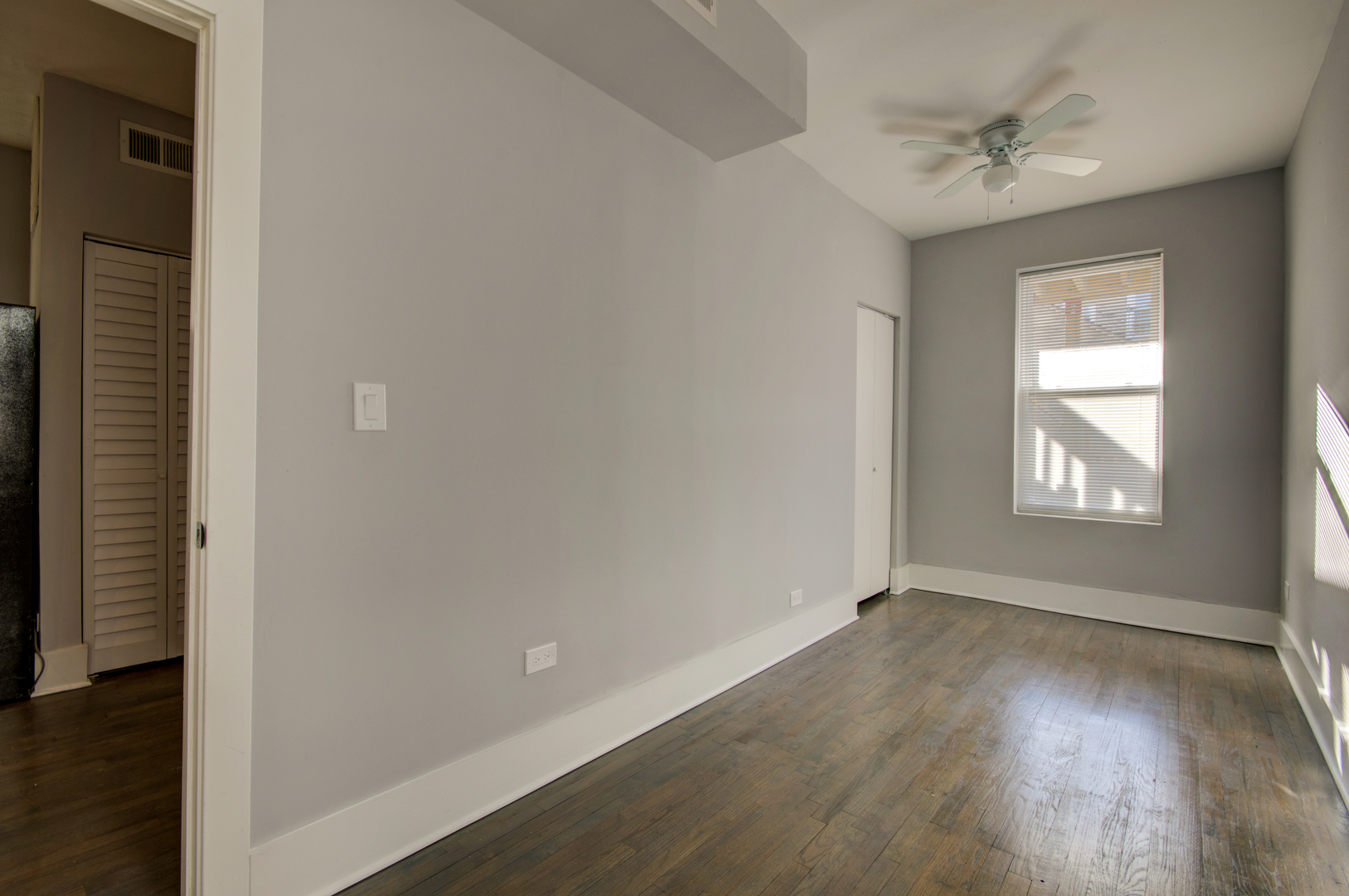 1706 South Carpenter Street, Unit 1R Chicago, IL 60608 - Photo 4 of 8 an empty room with windows and closet