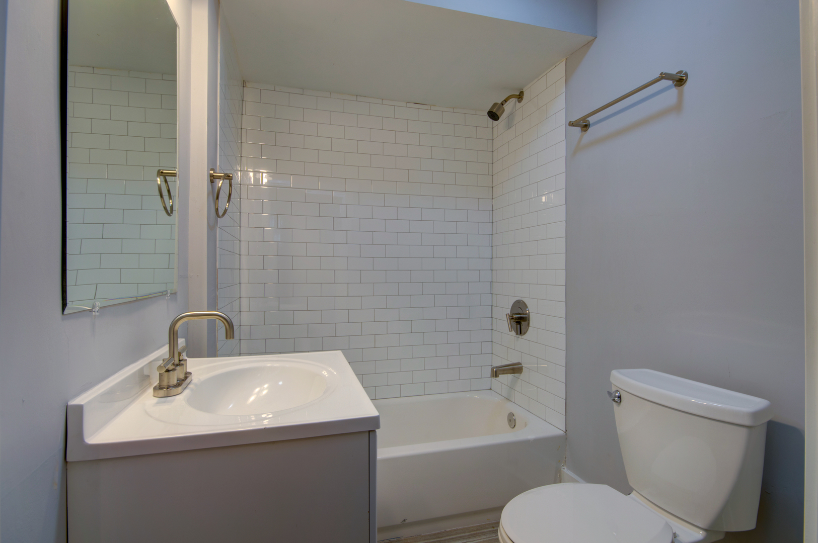 1706 South Carpenter Street, Unit 1R Chicago, IL 60608 - Photo 5 of 8 a bathroom with a sink toilet and shower