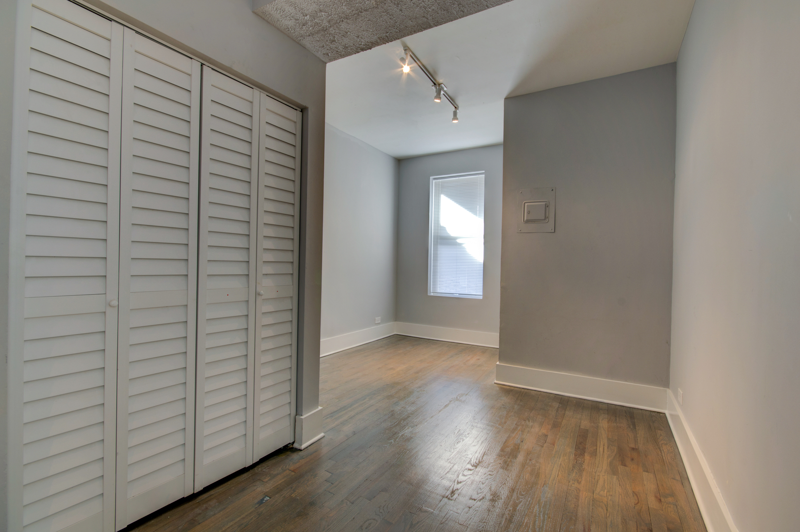 1706 South Carpenter Street, Unit 1R Chicago, IL 60608 - Photo 7 of 8 wooden floor in an empty room