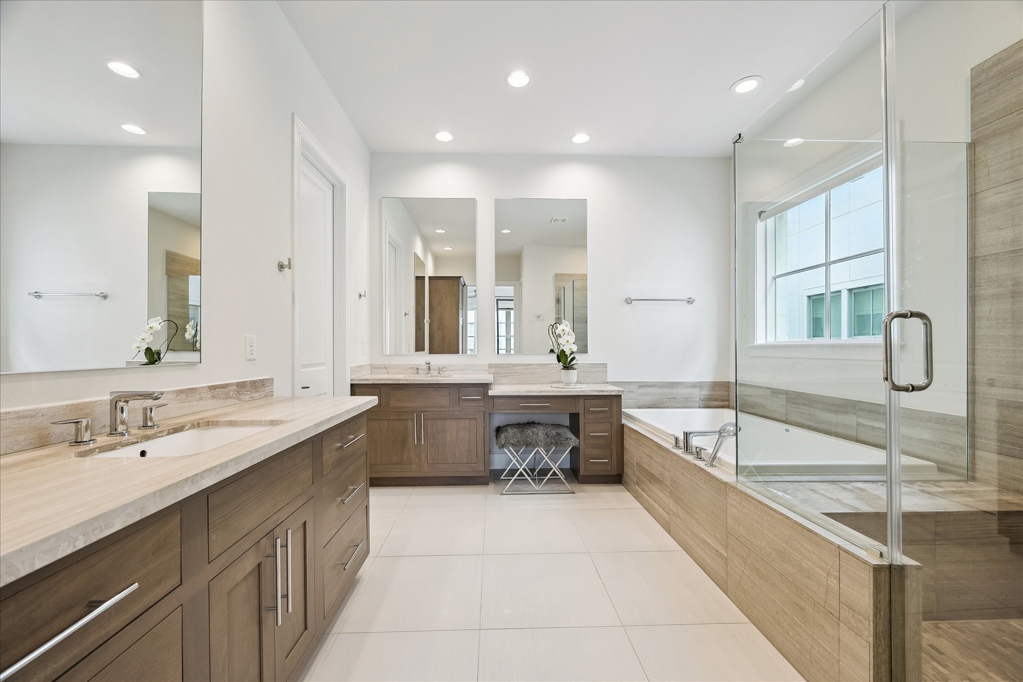 6108 Nicholas Grove Place Houston, TX 77055 - Photo 12 of 29 Take a deep breath and relax in this spa-inspired retreat, featuring dual vanities with dedicated seating space.