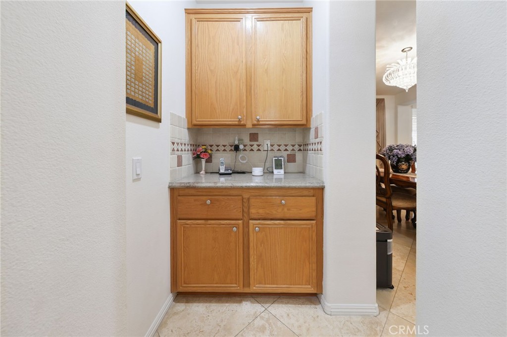 12830 Wildflower Lane Riverside, CA 92503 - Photo 16 of 34 a bathroom with a sink and a mirror