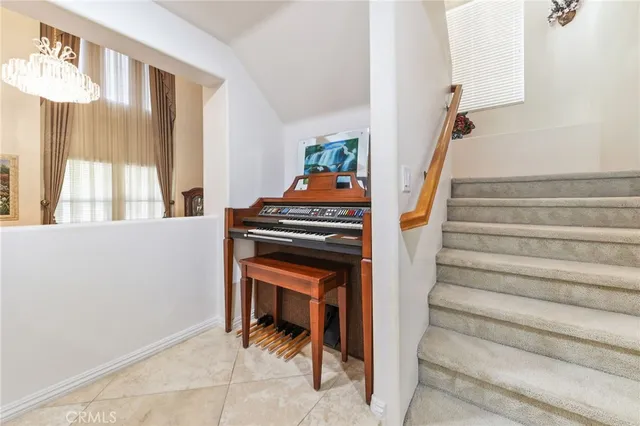 a spacious bedroom with a bed a couch and window