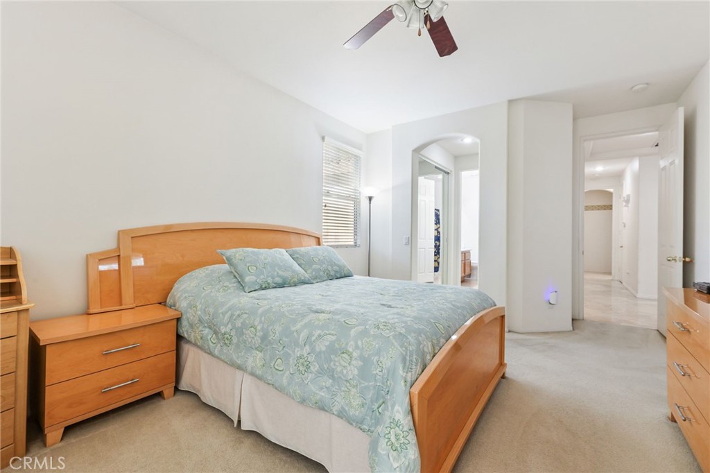 12830 Wildflower Lane Riverside, CA 92503 - Photo 28 of 34 a bedroom with a bed and closet