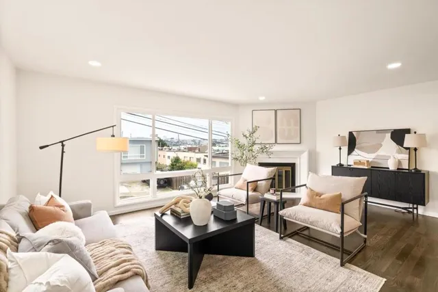 a living room with furniture fireplace and a fireplace