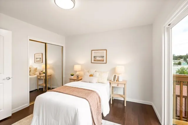 a bedroom with a bed and a table