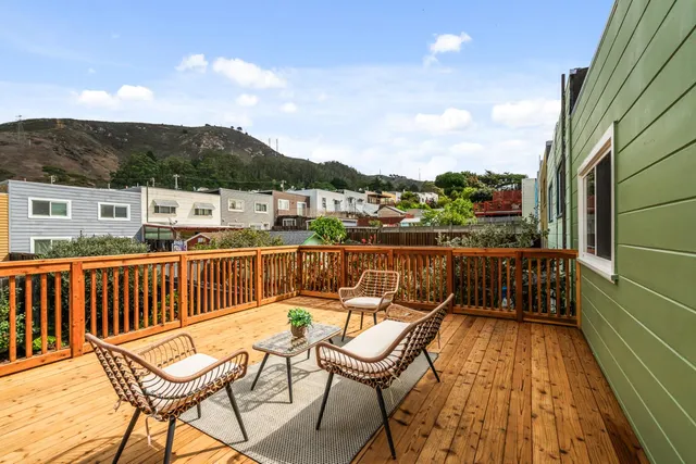 a view of a balcony with chairs