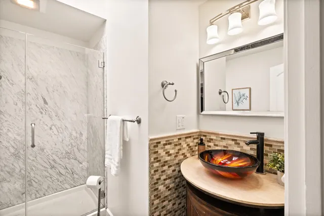 a bathroom with a sink and a mirror