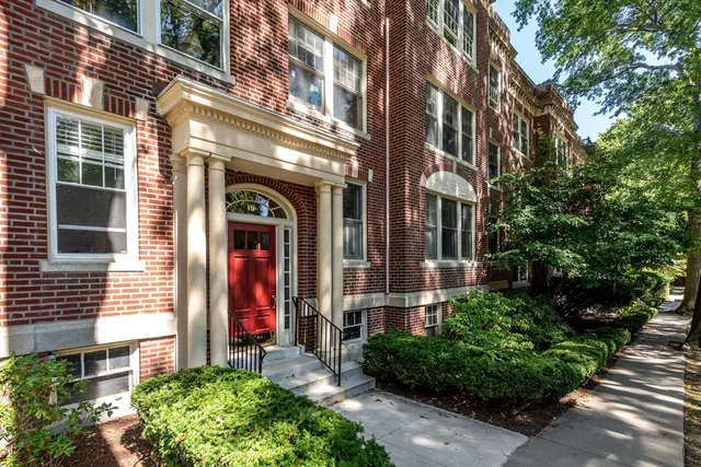 a view of a building with a yard