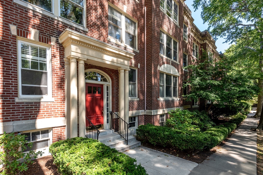 a view of a building with a yard
