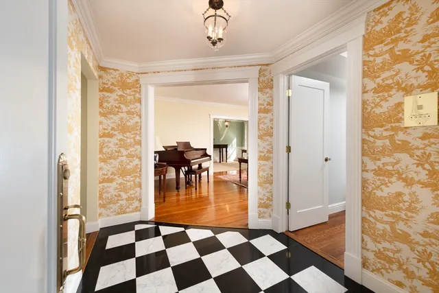 a hallway with a black and white checkered floor