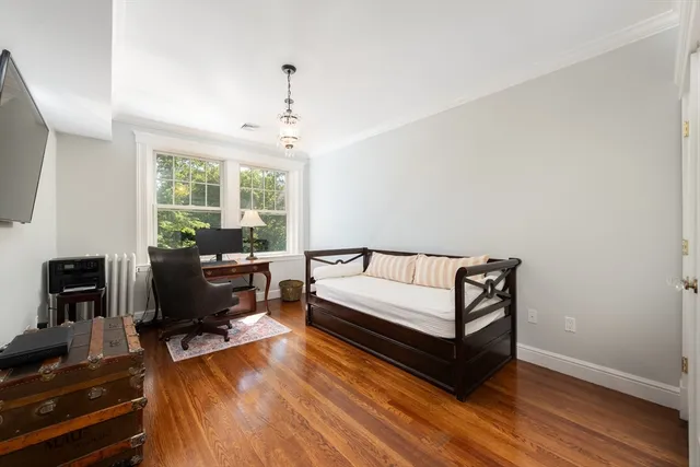 a living room with furniture fireplace and a flat screen tv