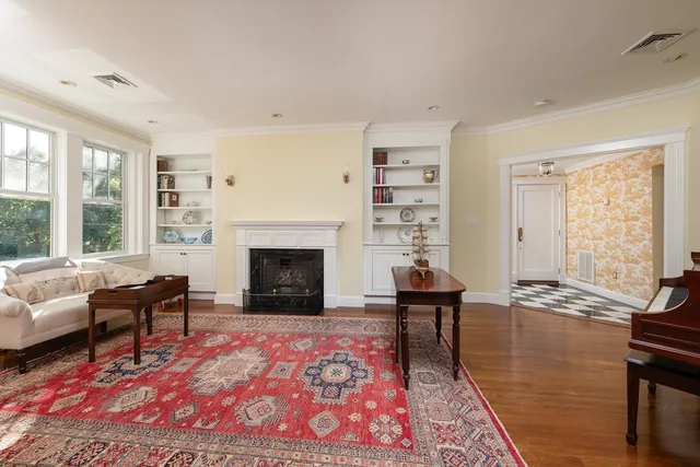 a living room with furniture rug and window