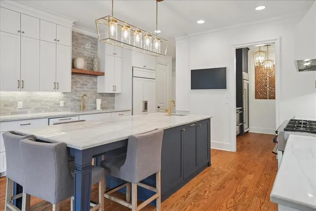 a kitchen with cabinets a sink and appliances