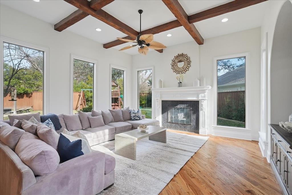 6807 Lupton Drive Dallas, TX 75225 - Photo 14 of 40 a living room with furniture a large window and a fireplace