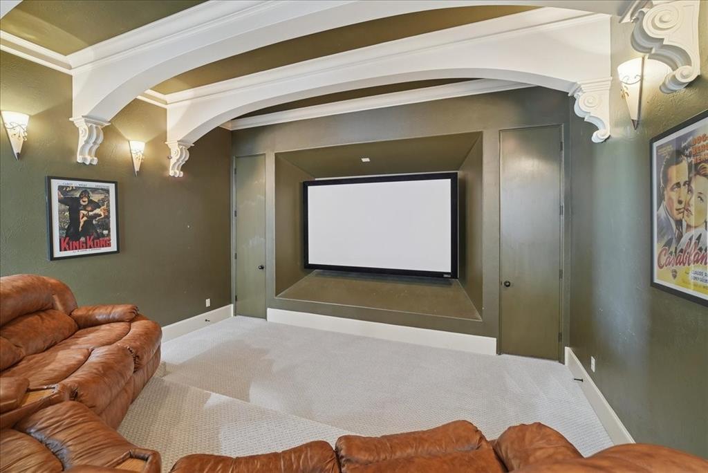 6807 Lupton Drive Dallas, TX 75225 - Photo 20 of 40 a bedroom with a bed and a painting on the wall