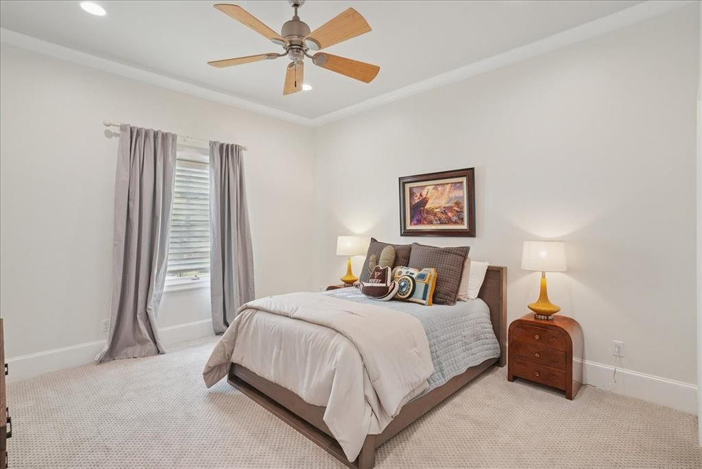 6807 Lupton Drive Dallas, TX 75225 - Photo 25 of 40 a bedroom with a bed and a chandelier