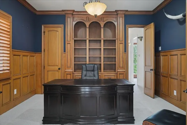 a view of kitchen with stainless steel appliances granite countertop a stove and a refrigerator