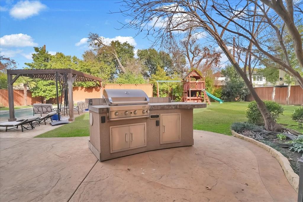 6807 Lupton Drive Dallas, TX 75225 - Photo 32 of 40 a view of a backyard with sitting area