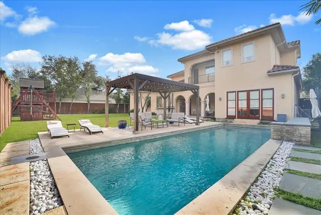 a view of a house with a swimming pool