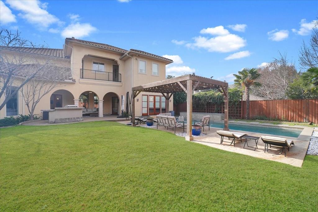 6807 Lupton Drive Dallas, TX 75225 - Photo 35 of 40 a backyard of a house with table and chairs