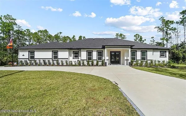 front view of a house with a patio