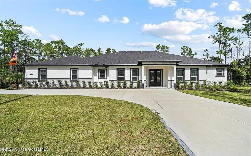 3230 Pheasant Trail Mims, FL 32754 - Photo 1 of 1 front view of a house with a patio