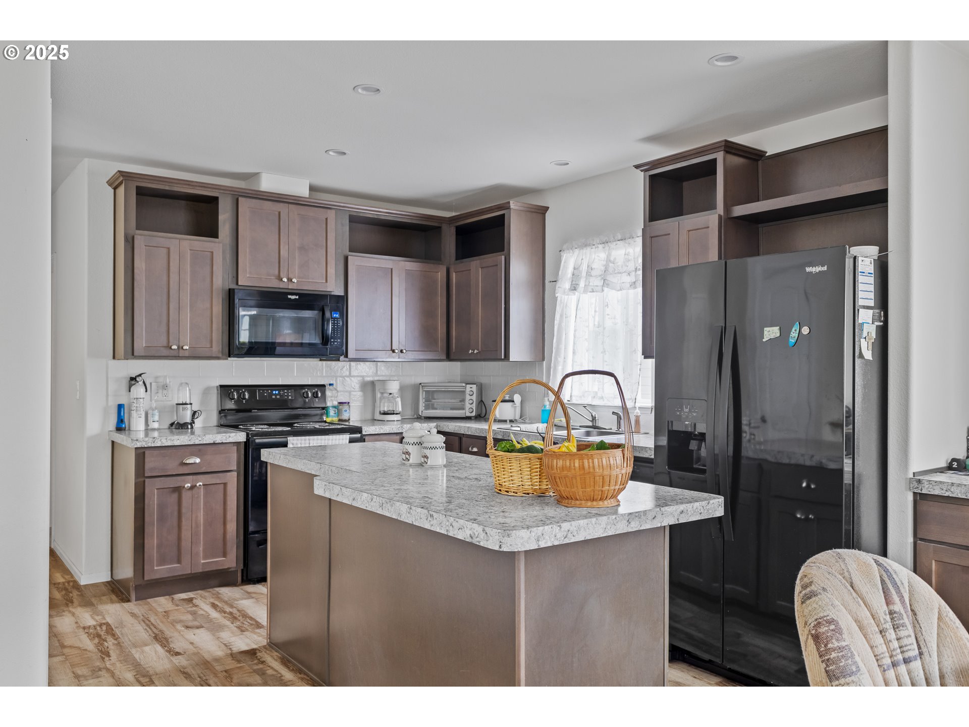 1873 East Cedar Street Myrtle Point, OR 97458 - Photo 11 of 27 a kitchen with stainless steel appliances granite countertop a stove top oven a sink and dishwasher
