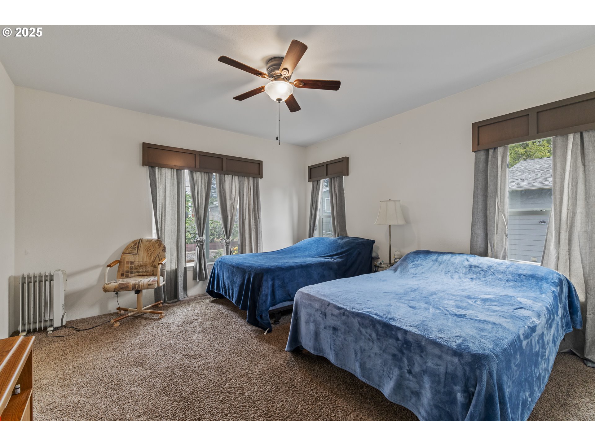 1873 East Cedar Street Myrtle Point, OR 97458 - Photo 16 of 27 a bedroom with two beds and a chandelier