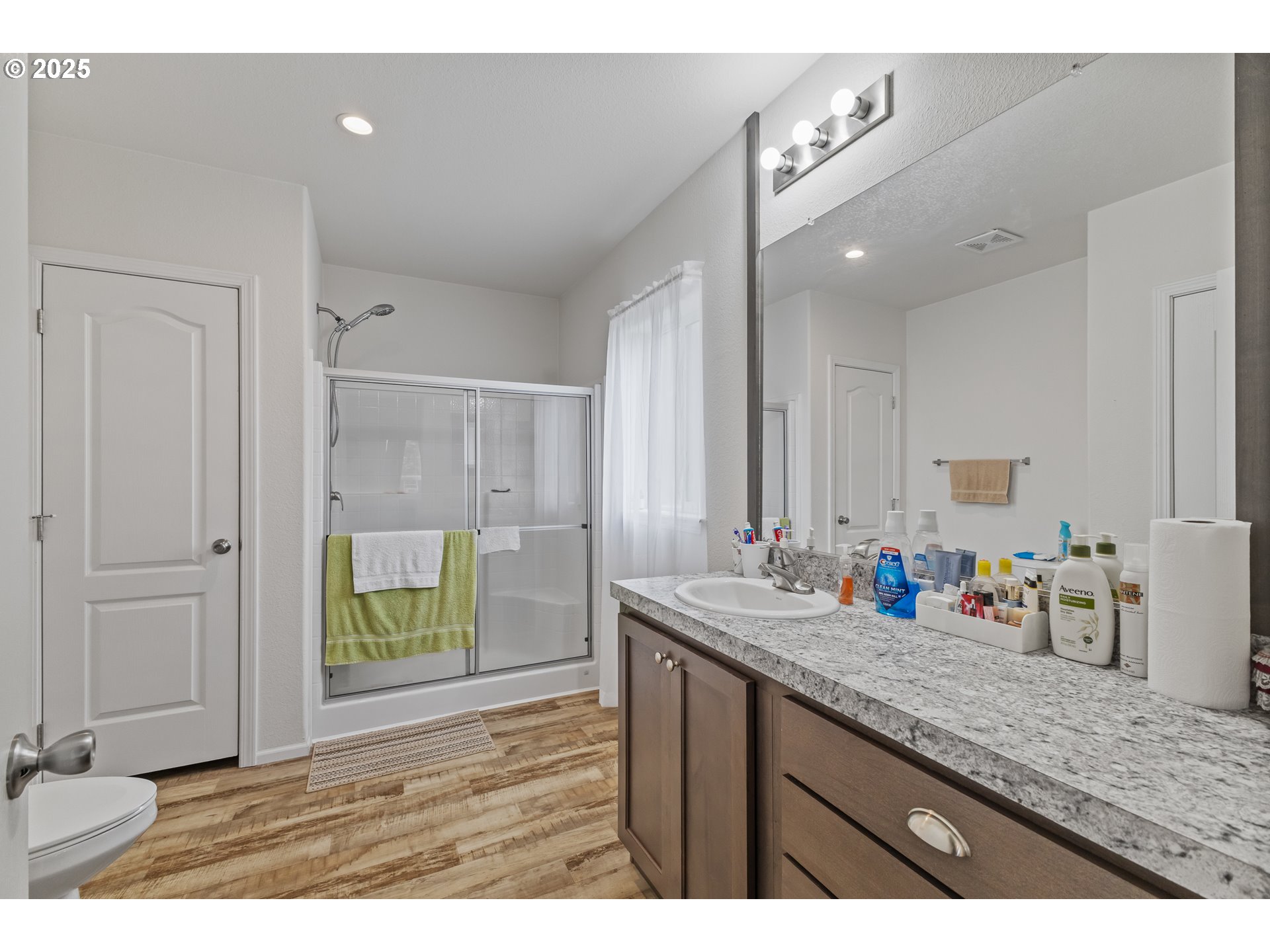 1873 East Cedar Street Myrtle Point, OR 97458 - Photo 18 of 27 a bathroom with a granite countertop sink mirror and double